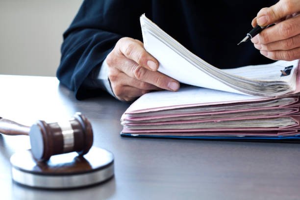 Judge with gavel on table